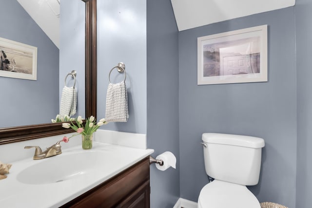 bathroom featuring toilet and vanity