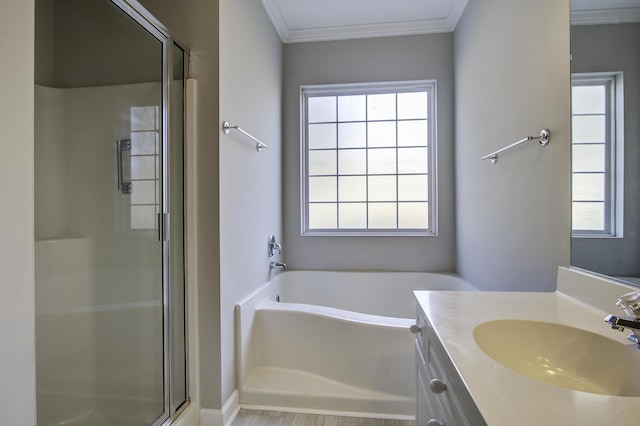 bathroom with plus walk in shower, vanity, and ornamental molding