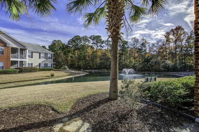 view of yard with a water view