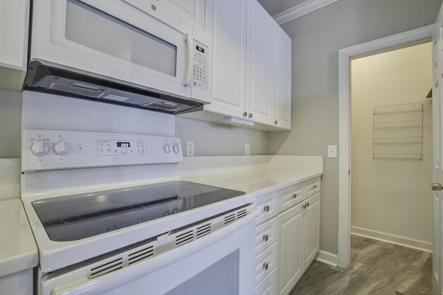 kitchen featuring white cabinetry, white appliances, and ornamental molding