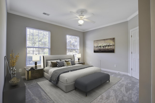 bedroom with carpet flooring, ceiling fan, and crown molding