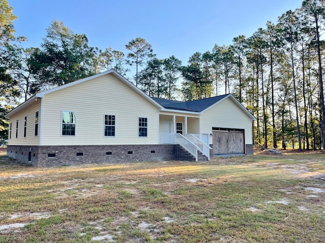 back of property featuring a garage