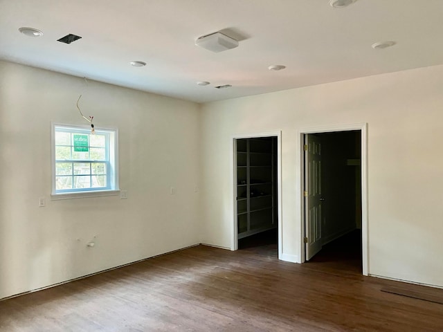 spare room featuring dark hardwood / wood-style floors