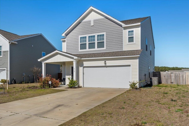 view of front facade with an attached garage, fence, roof with shingles, a front yard, and driveway