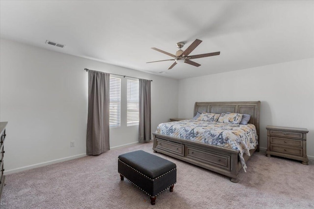 bedroom featuring visible vents, baseboards, carpet, and a ceiling fan