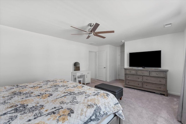 bedroom featuring ceiling fan, baseboards, visible vents, and light carpet