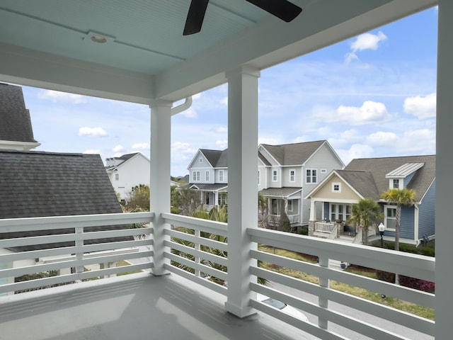 balcony with a ceiling fan and a residential view