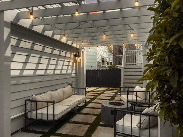 exterior space with a pergola, fence, and an outdoor living space with a fire pit