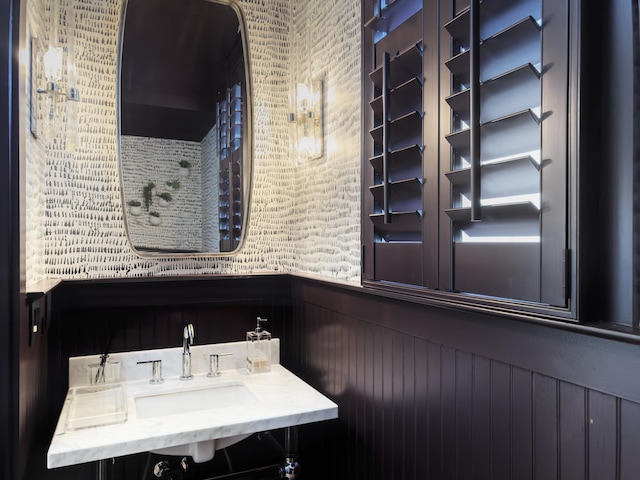 bathroom featuring a sink and wainscoting