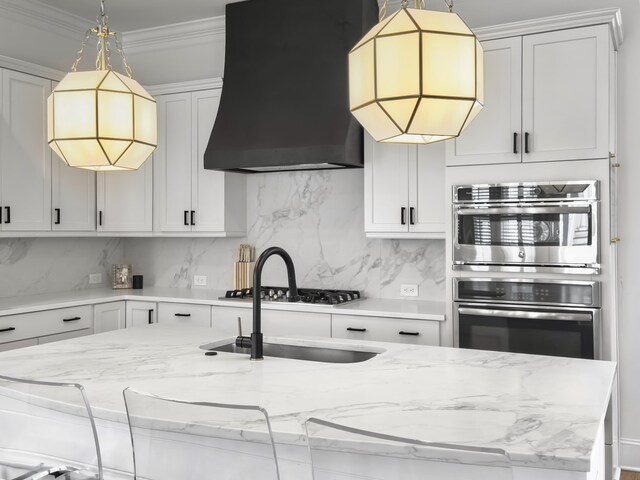 kitchen featuring a sink, appliances with stainless steel finishes, exhaust hood, and tasteful backsplash