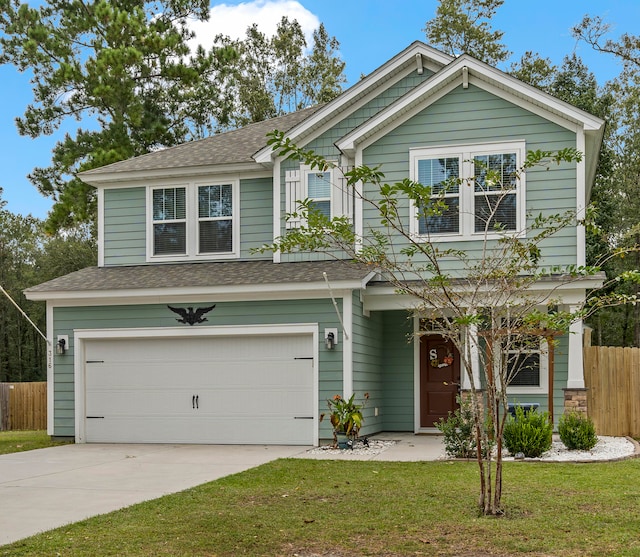 view of front of house featuring a garage and a front yard