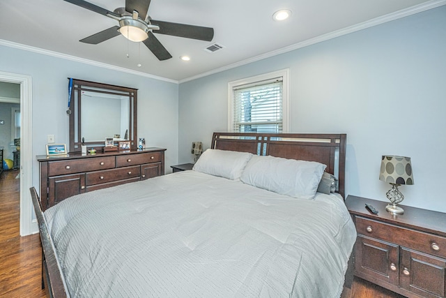 bedroom featuring crown molding, dark hardwood / wood-style floors, and ceiling fan