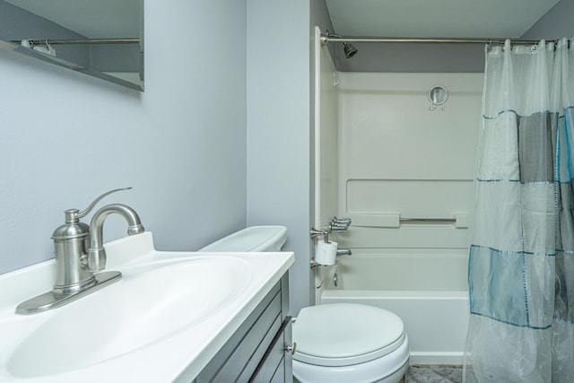 full bathroom featuring vanity, shower / bath combination with curtain, and toilet