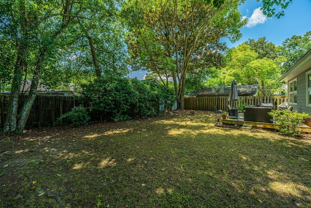 view of yard featuring a wooden deck