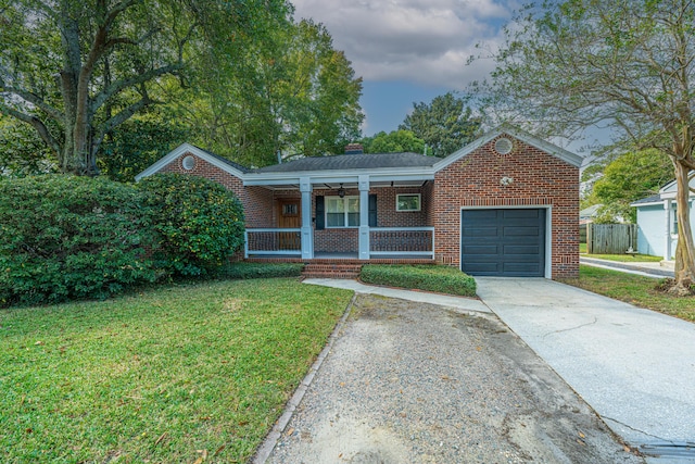 view of front facade with a garage, covered porch, and a front lawn