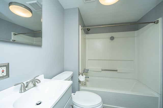 full bathroom featuring vanity, bathtub / shower combination, and toilet