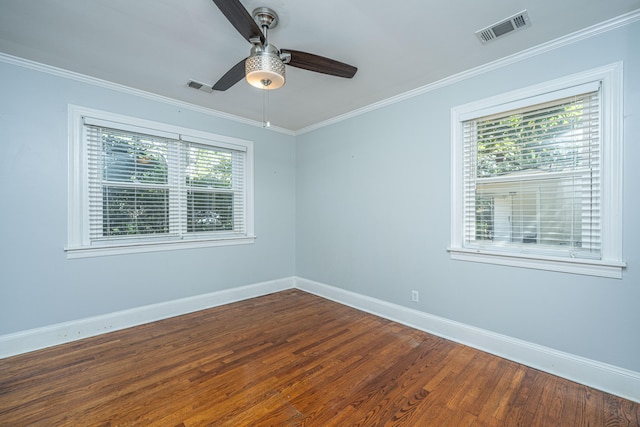 unfurnished room featuring dark hardwood / wood-style flooring, crown molding, and ceiling fan