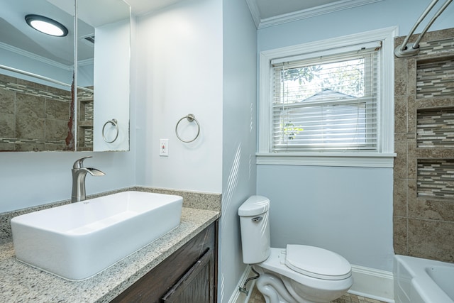 full bathroom featuring vanity, tiled shower / bath, ornamental molding, and toilet