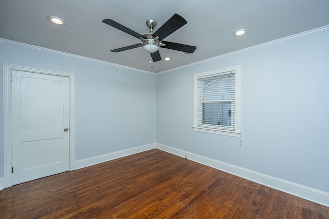 spare room with ornamental molding, ceiling fan, and dark hardwood / wood-style flooring