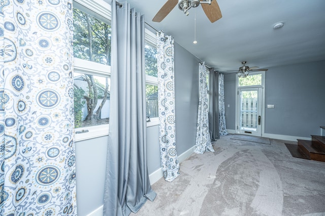 doorway featuring light carpet