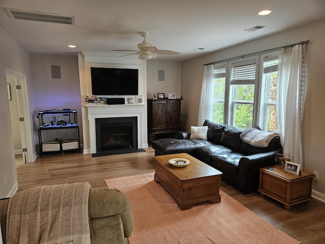 1495 Keshi Pearl Dr, Mount Pleasant, SC 29466 - living room with light wood-type flooring, a ceiling fan, recessed lighting, baseboards, and a fireplace with flush hearth