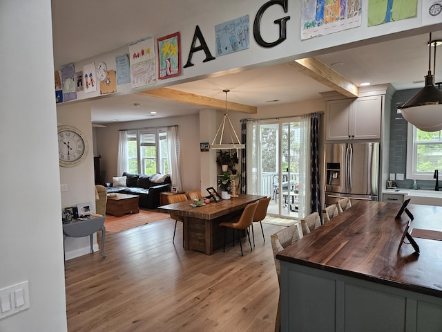 1495 Keshi Pearl Dr, Mount Pleasant, SC 29466 - dining area featuring light wood-style flooring and beamed ceiling