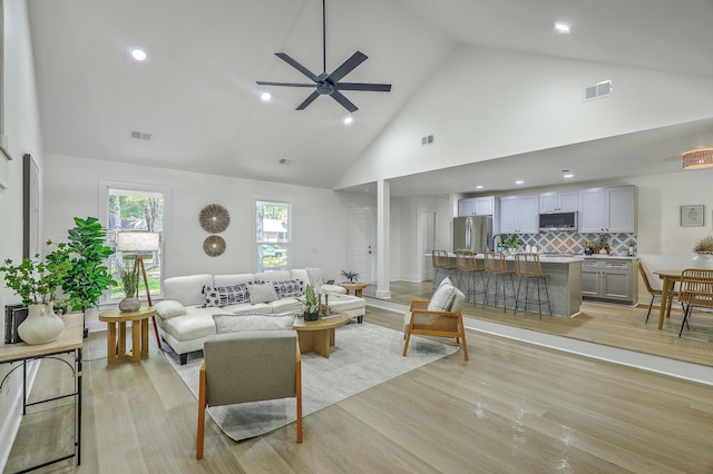 169 Southwold Cir, Goose Creek, SC 29445 - living room with high vaulted ceiling, ceiling fan, light wood finished floors, and recessed lighting