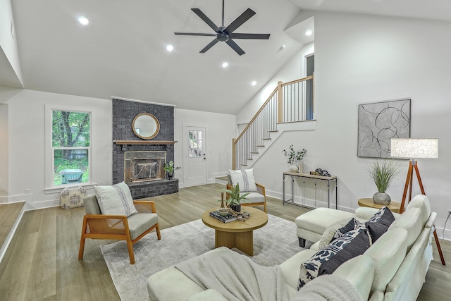 169 Southwold Cir, Goose Creek, SC 29445 - living room featuring high vaulted ceiling, ceiling fan, stairway, a brick fireplace, and recessed lighting