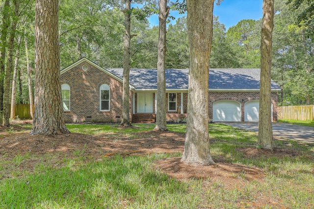 169 Southwold Cir, Goose Creek, SC 29445 - view of front of home with crawl space, fence, a garage, driveway, and brick siding