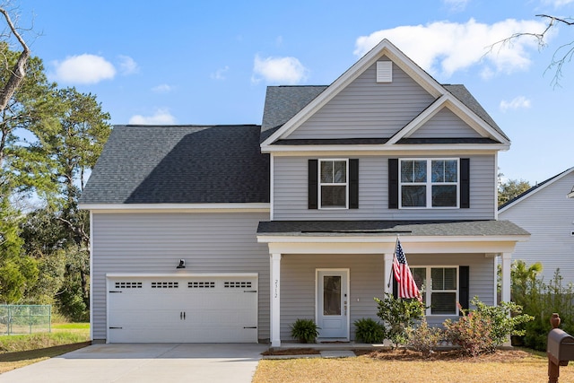 traditional-style home with driveway, fence, a porch, and roof with shingles