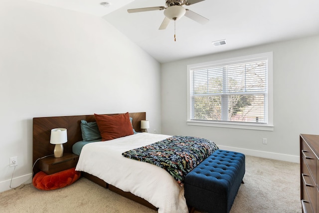 carpeted bedroom featuring lofted ceiling, ceiling fan, visible vents, and baseboards