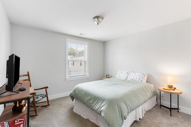 bedroom with baseboards, visible vents, and light colored carpet