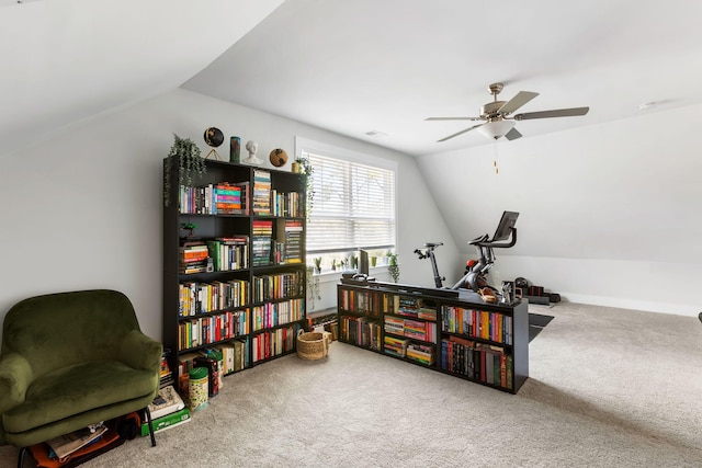 sitting room with lofted ceiling, ceiling fan, and carpet flooring