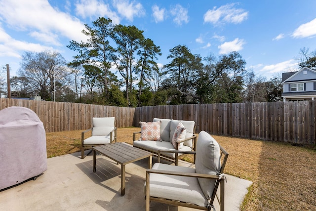 view of patio / terrace featuring a fenced backyard and an outdoor living space