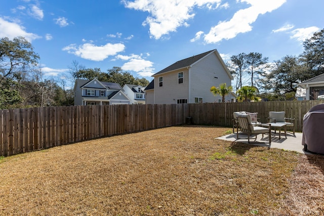 view of yard featuring a patio area and a fenced backyard