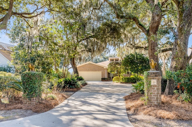 obstructed view of property featuring a garage