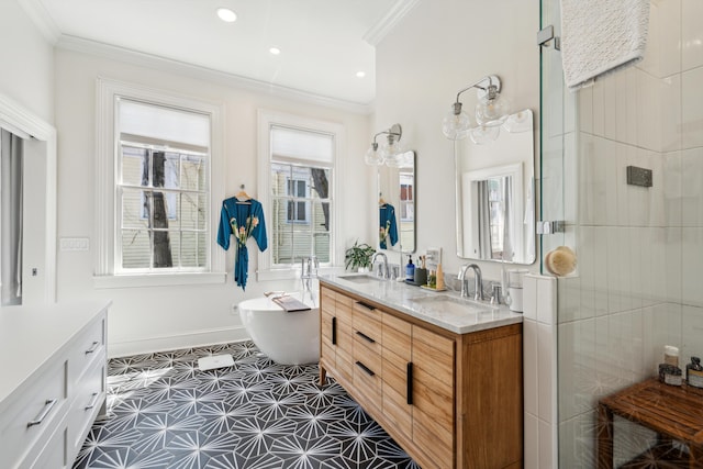 11 Franklin St, Charleston, SC 29401 - bathroom featuring ornamental molding, a freestanding tub, double vanity, tiled shower, and baseboards