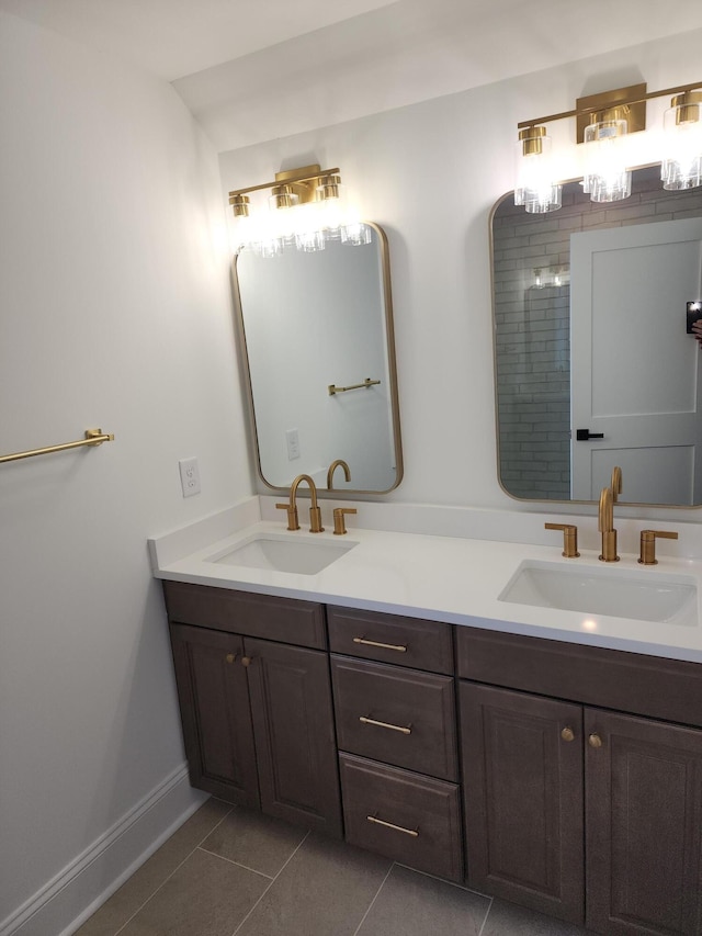 bathroom with tile patterned flooring and vanity