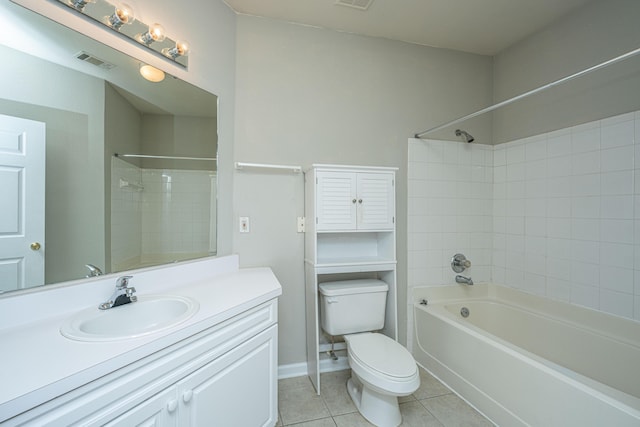 full bathroom featuring tile patterned flooring, vanity, toilet, and tiled shower / bath combo