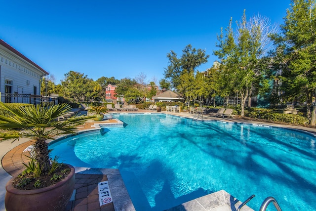 view of swimming pool with a patio