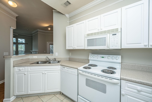 kitchen featuring sink, light tile patterned floors, crown molding, white appliances, and white cabinets