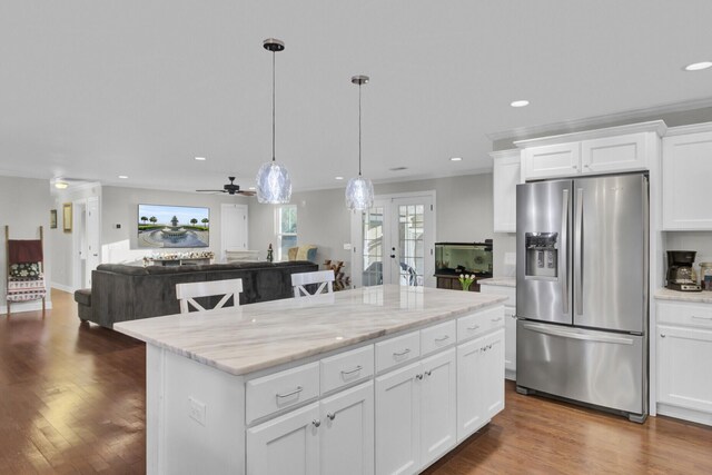 kitchen with white cabinetry, french doors, stainless steel refrigerator with ice dispenser, pendant lighting, and a kitchen island