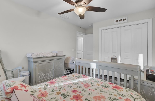 bedroom with ceiling fan and a closet