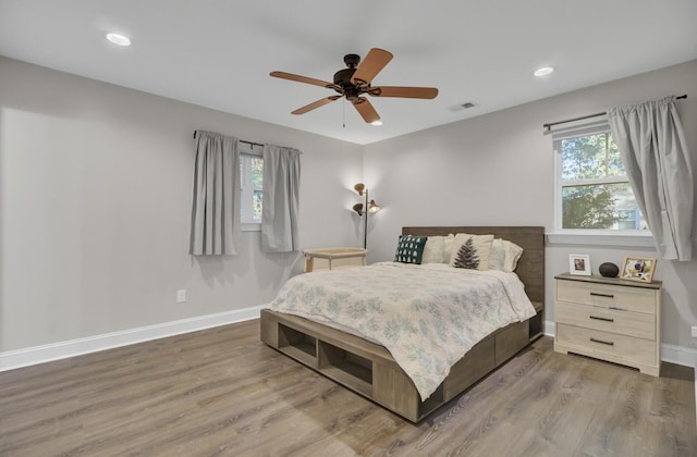 bedroom featuring hardwood / wood-style flooring and ceiling fan