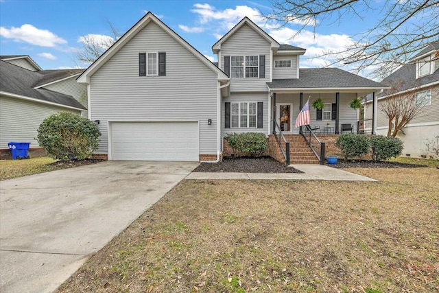 traditional-style home with a garage, covered porch, concrete driveway, and a front yard