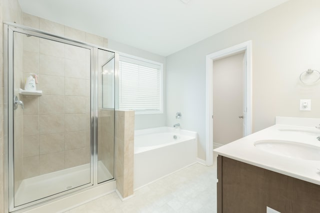 bathroom with vanity and separate shower and tub