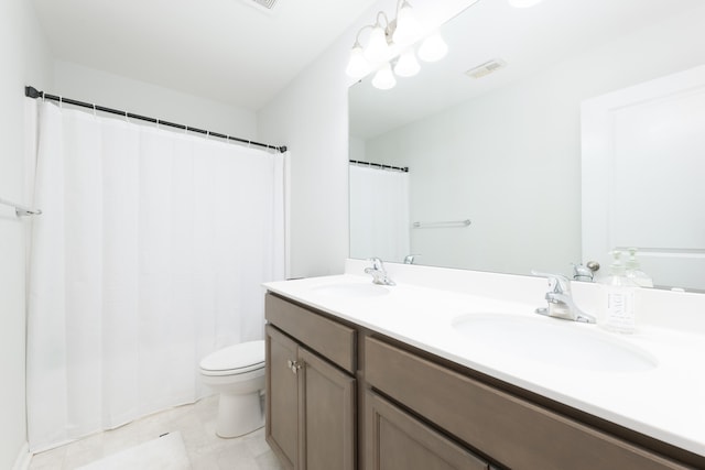 bathroom featuring walk in shower, vanity, and toilet