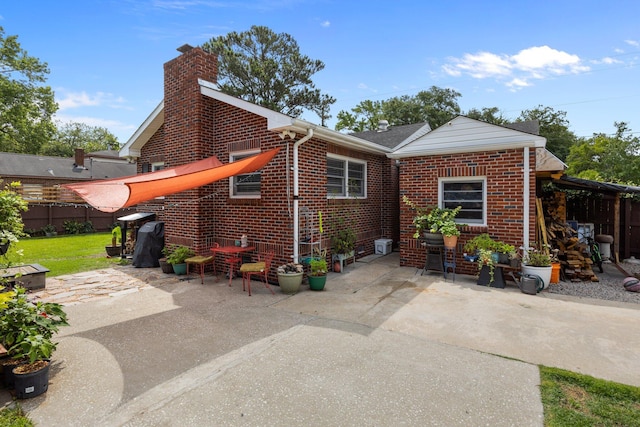 2651 Martha Dr, North Charleston, SC 29405 - rear view of property with a patio area, brick siding, and a chimney
