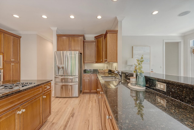 kitchen featuring recessed lighting, ornamental molding, and stainless steel fridge