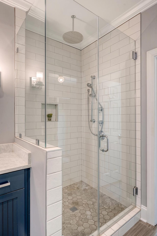 full bath featuring a stall shower and vanity